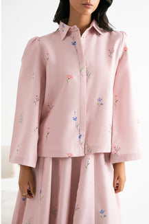 Pink floral printed shirt and skirt set on a white background